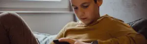 Teenager using a smartphone