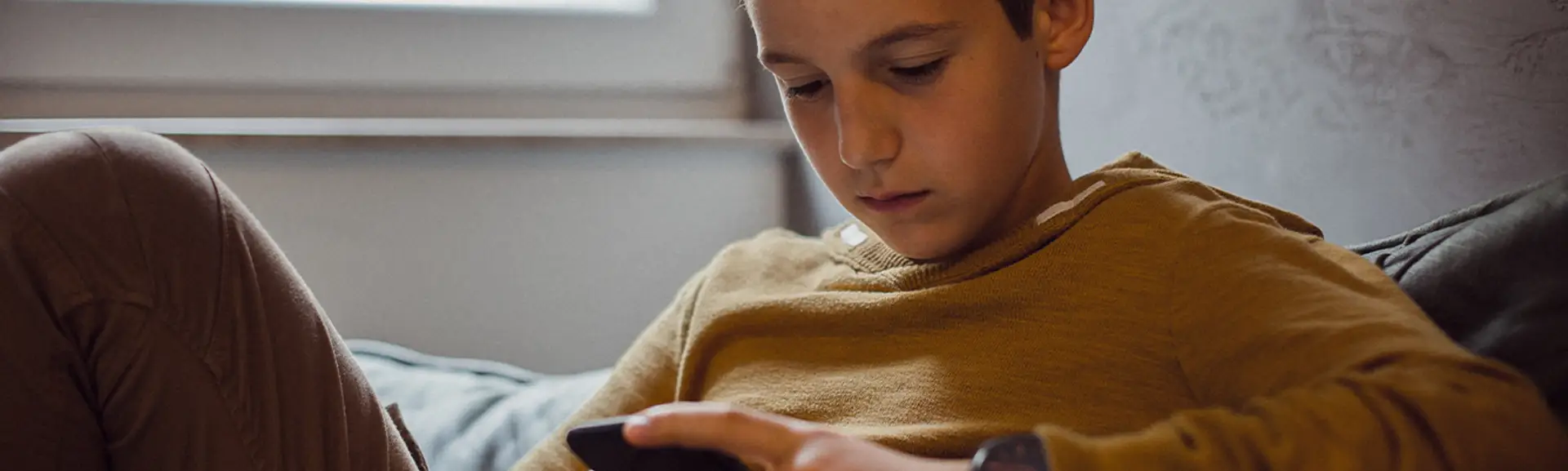 Teenager using a smartphone
